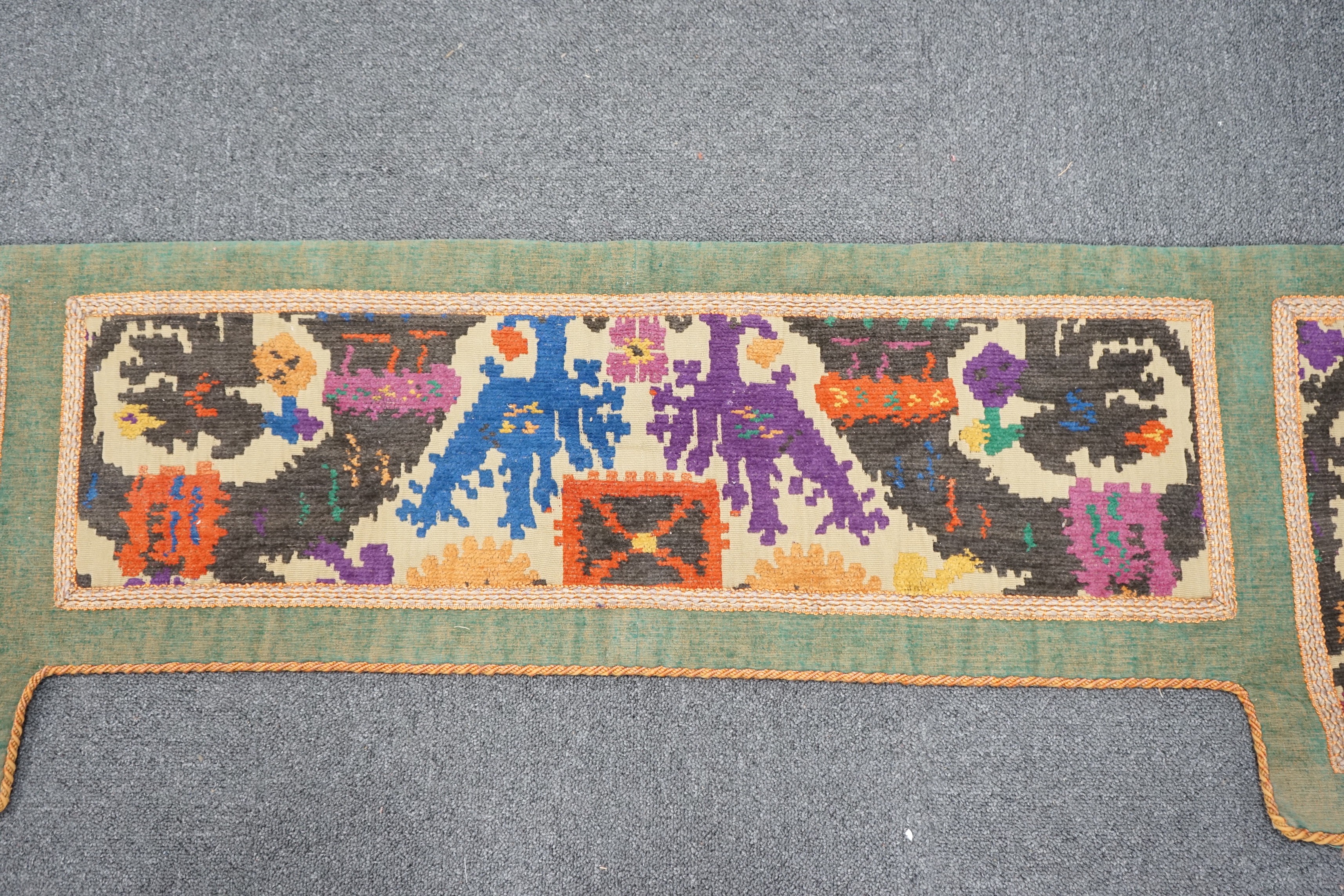 A 1920's English needlework pelmet, 205cm wide